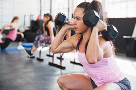 Patient performing a supervised squat for exercise rehabilitation